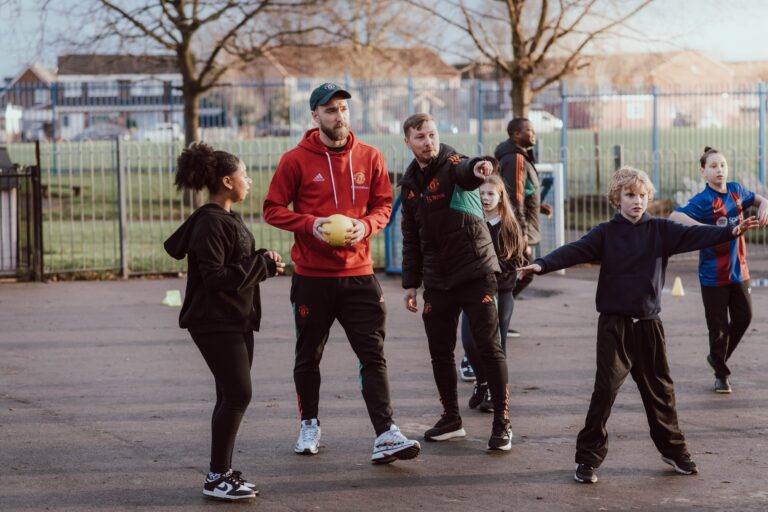 Manchester United’s Christian Eriksen surprises pupils at Old Trafford school