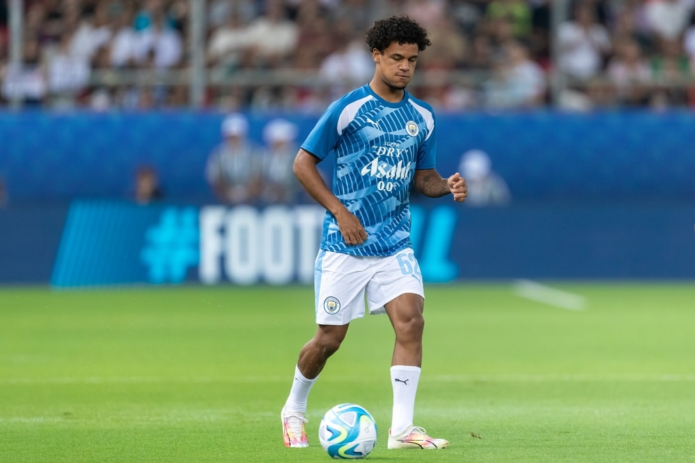 Oscar Bobb playing football for Man City