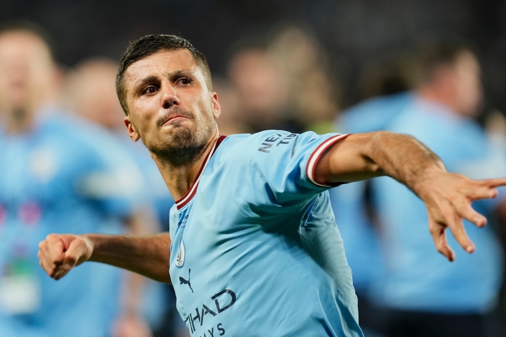 Rodri playing football for Man City