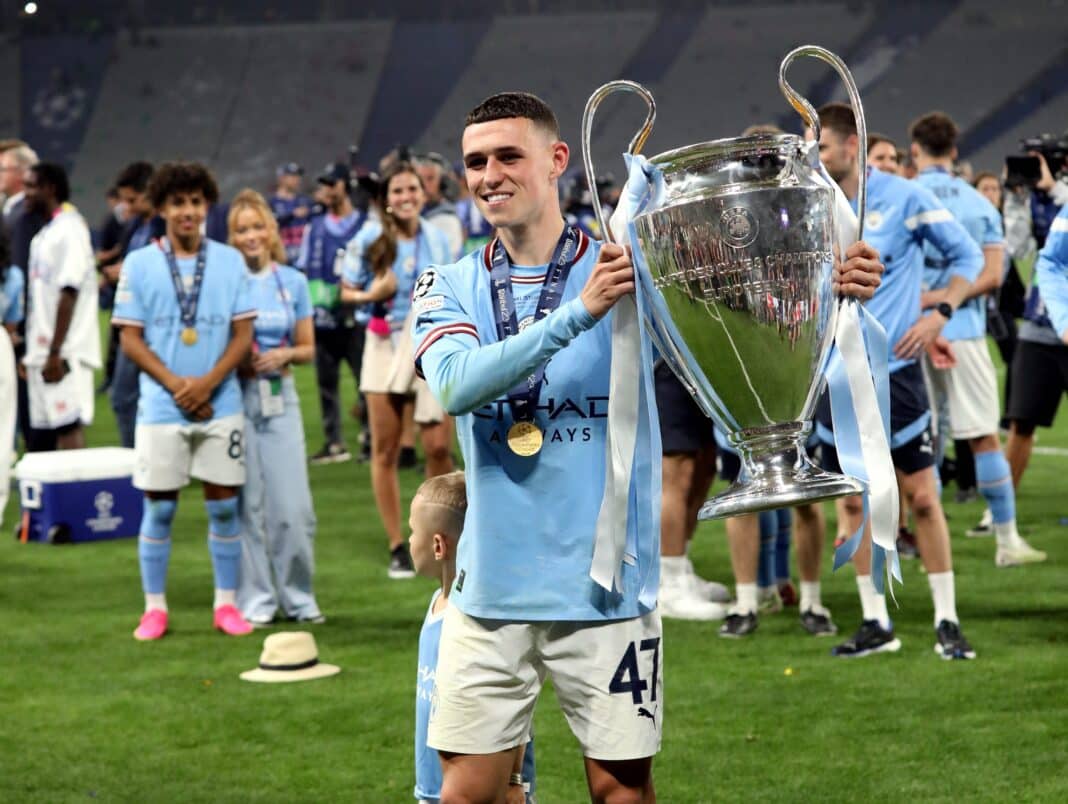 Manchester City star Phil Foden poses with the Champions League trophy last June