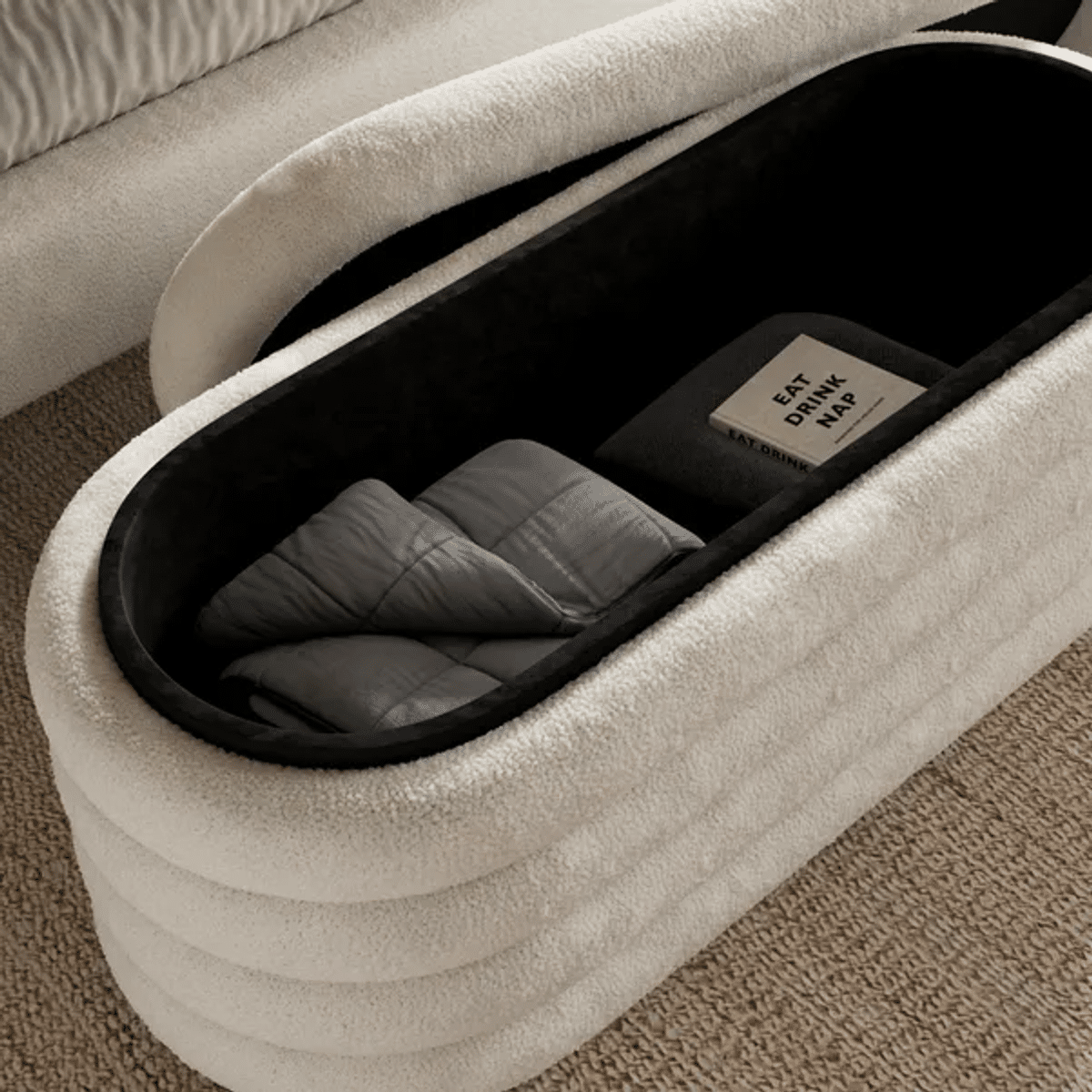 Shoppers love the Murray Storage Ottoman Sherpa's 'modern design'